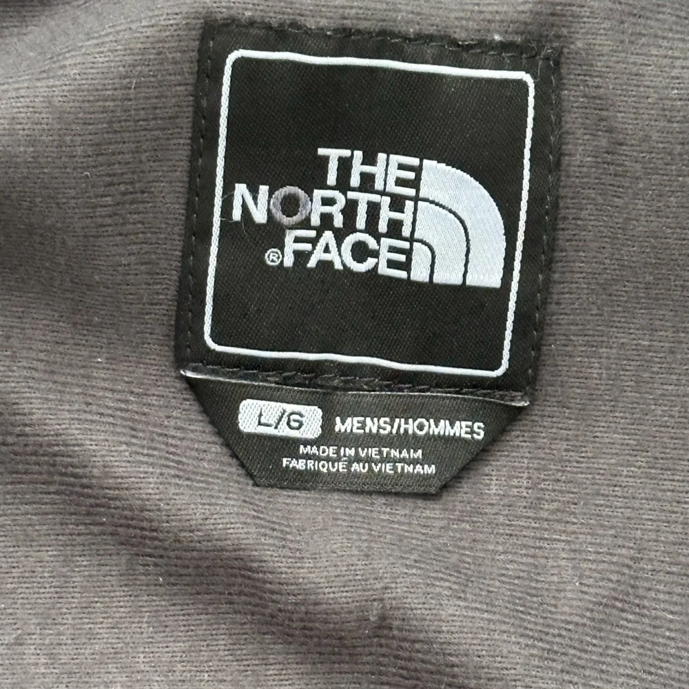 The North Face Black Hooded Raincoat with Multiple Front Pockets